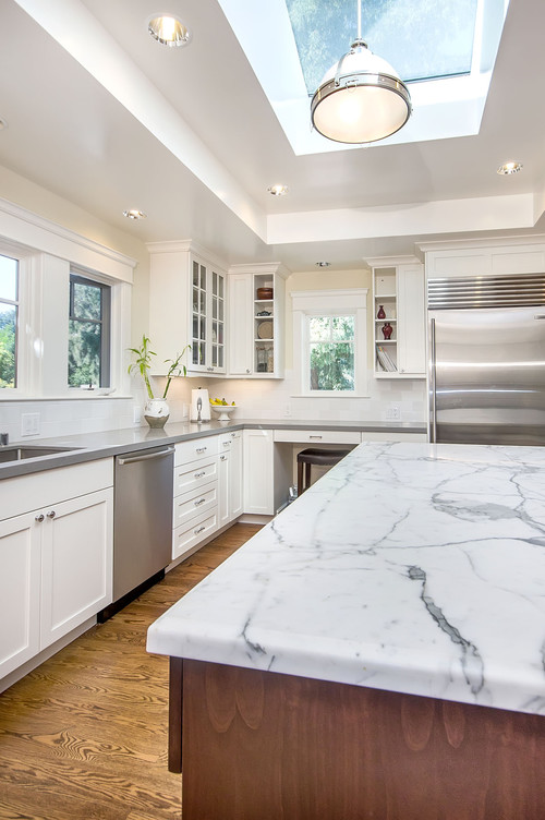 White Carrarra Marble Countertop combines well with Concrete Ceasar Stone